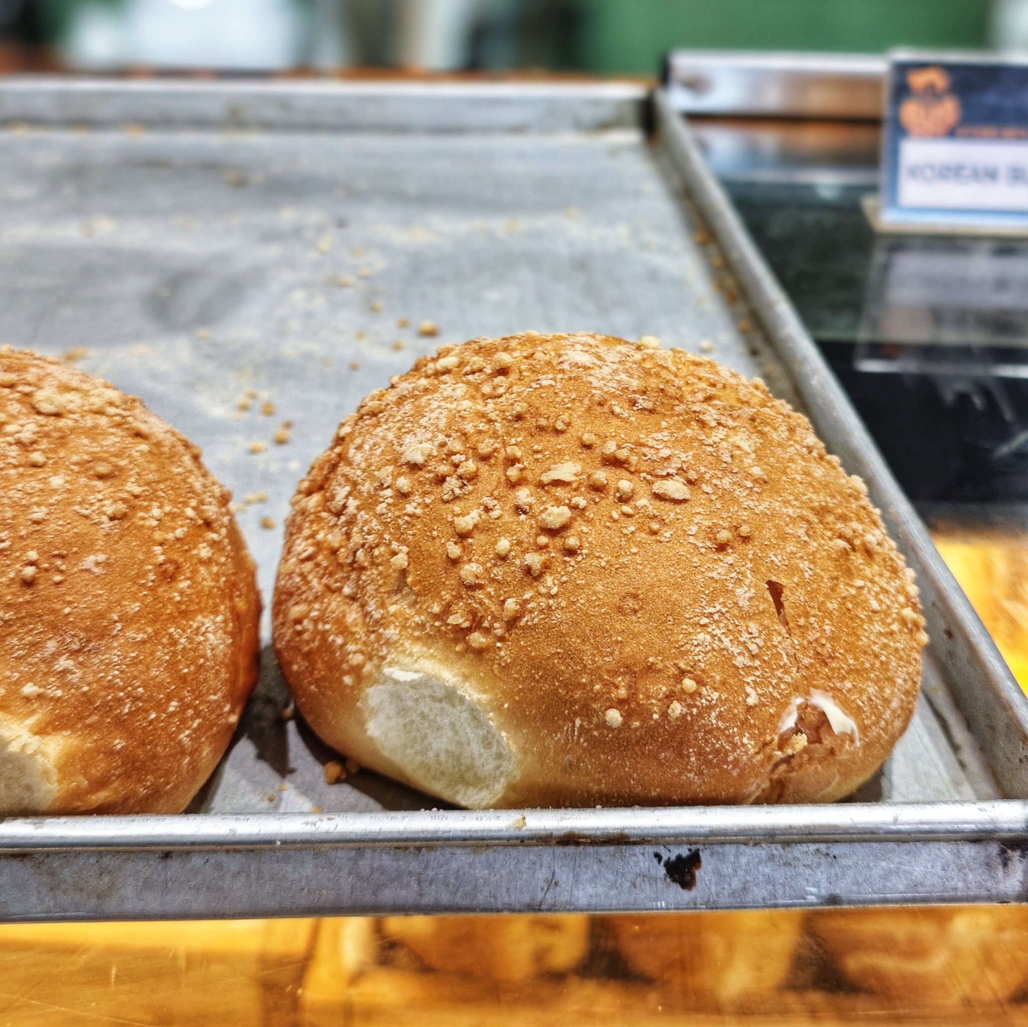Golden bread rolls with a crumb-dusted crust, by Vishnu Chandra